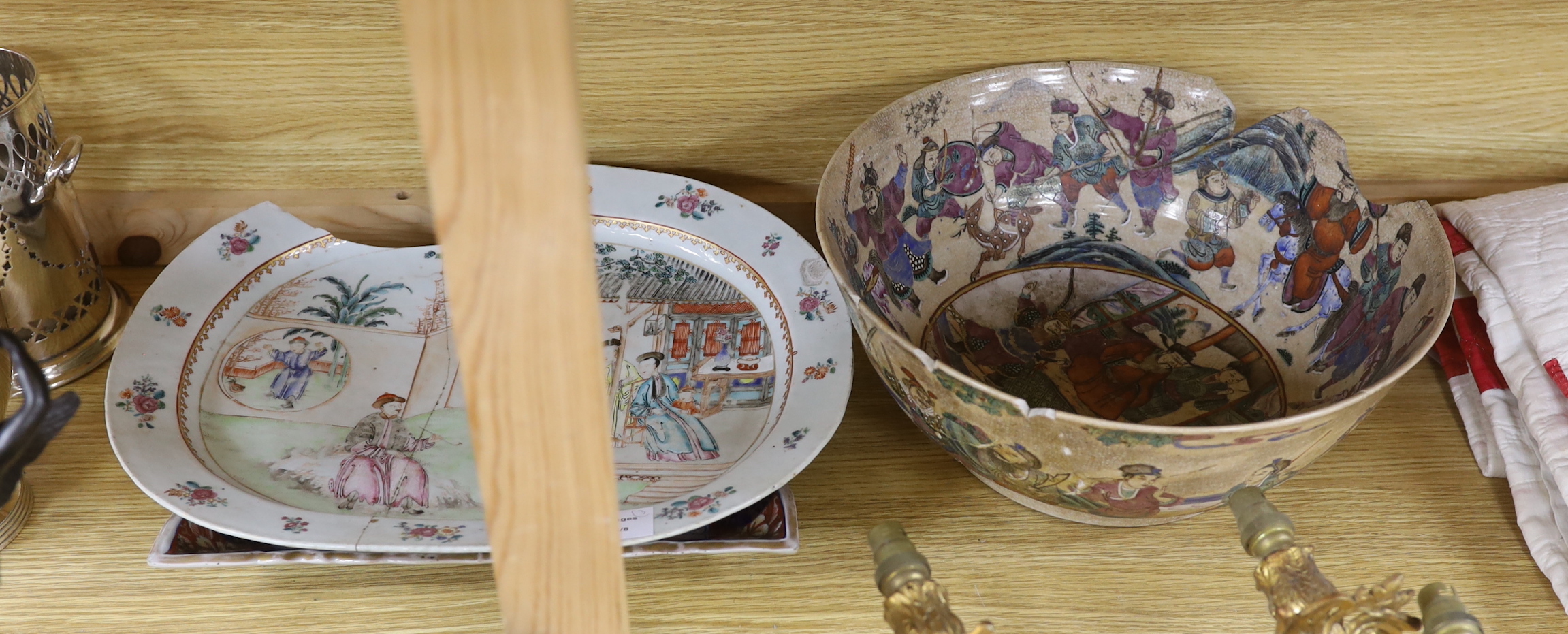 An 18th century Chinese export ware meat plate painted with a courtyard scene with figures (a.f.), a large Chinese porcelain crackle glaze warrior bowl (a.f.), together with a rectangular Japanese Imari palette export di